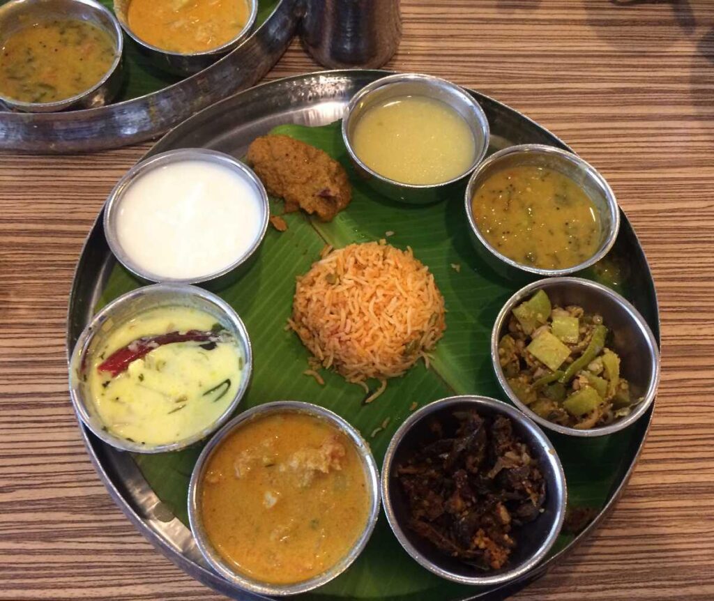 Traditional Konaseema Ruchulu vegetarian thali served on a banana leaf showcasing the rich food culture of Andhra Pradesh
